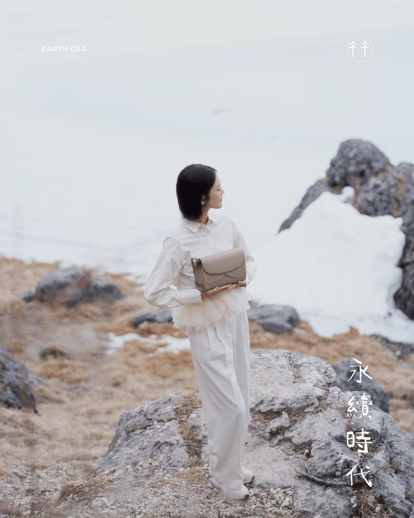 SOULMATTE's founder showcasing Mini Lotus in Sand Beige in front of the Snowy lake